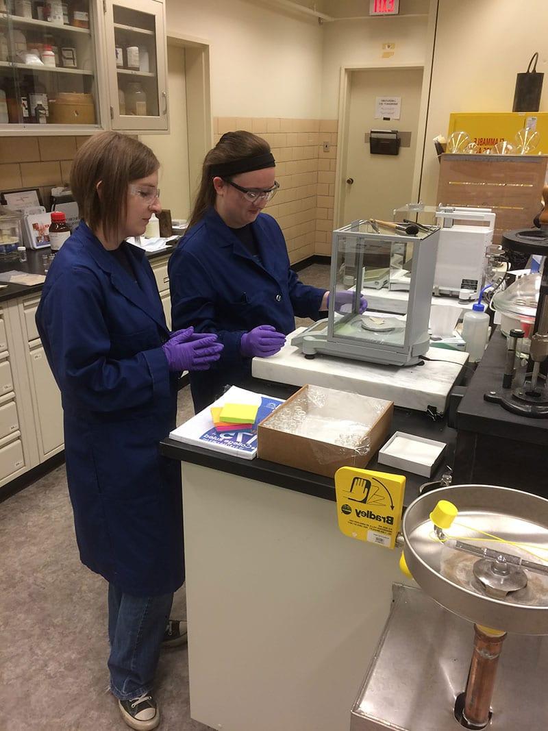 Forensic science majors, Katie Agosta and Kelsey Vancil, demonstrated forensic science skills to lab managers at the Library of Congress